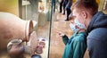 Athens, Greece Ã¢â¬â December 27, 2021: Tourists boy and men visit the museum Agora in the Athens in a medical mask.